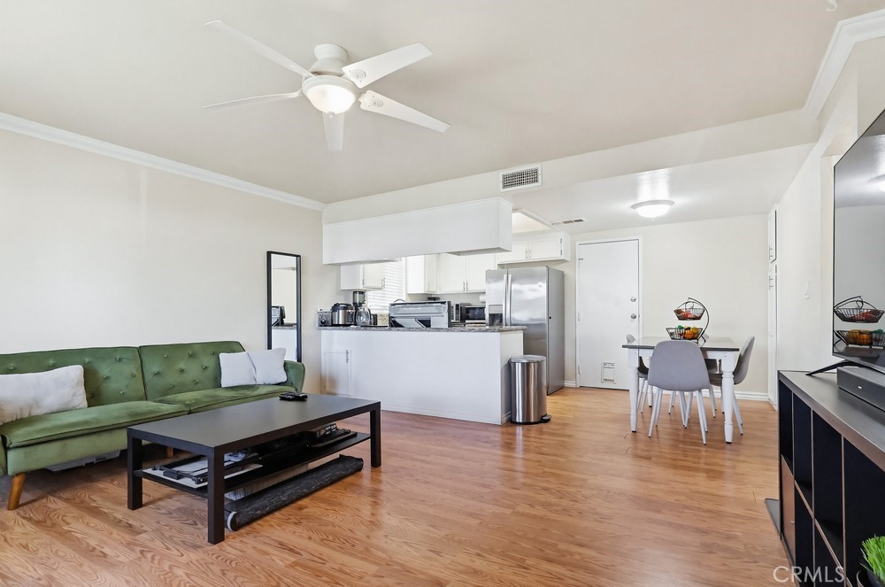 13470 Meyer Road, Unit 22 Whittier, CA 90605 - Photo 8 of 50 a living room with furniture and kitchen view