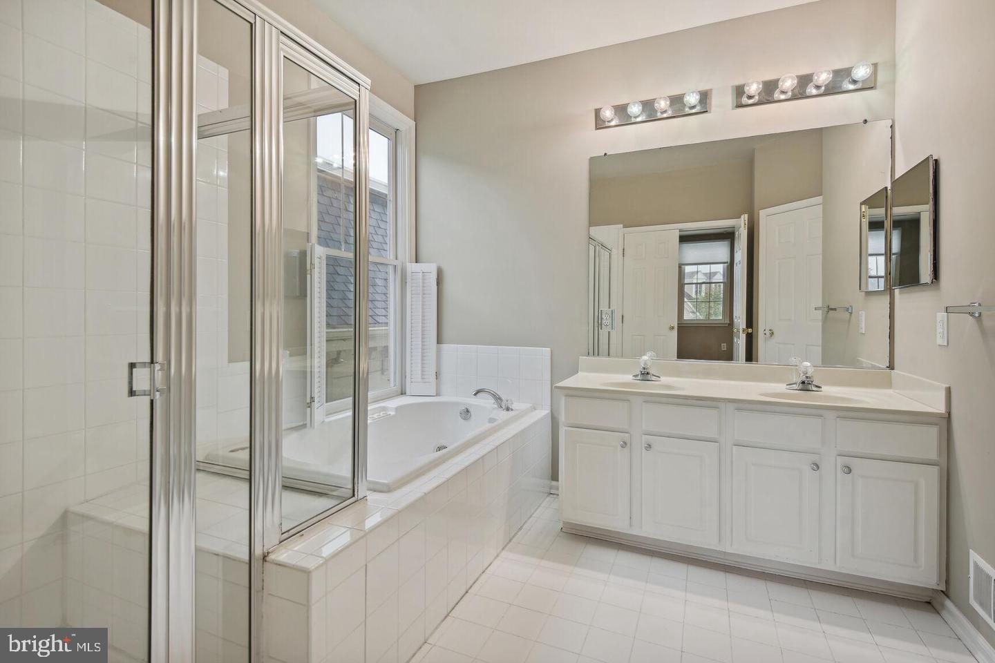 337 Main Street Gaithersburg, MD 20878 - Photo 21 of 35 a spacious bathroom with a double vanity sink mirror and bathtub