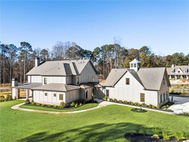 an aerial view of a house with outdoor space
