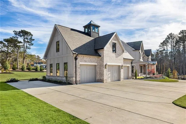 an aerial view of a swimming pool with a yard