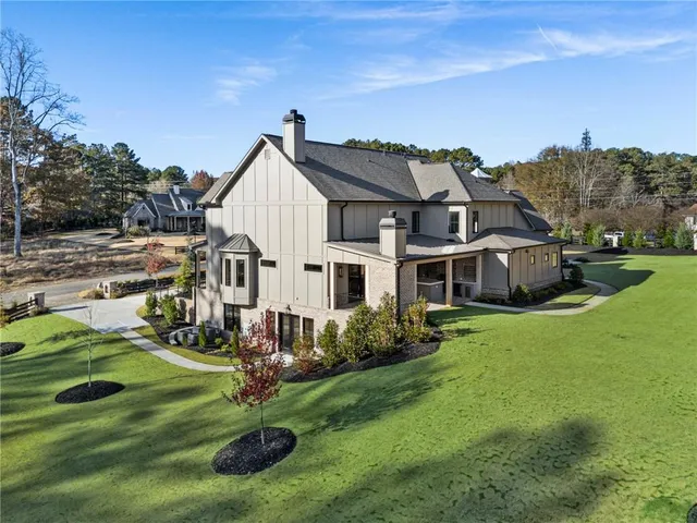 a view of living room with furniture and large windows