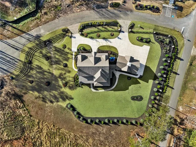 a living room with furniture fireplace and a large window