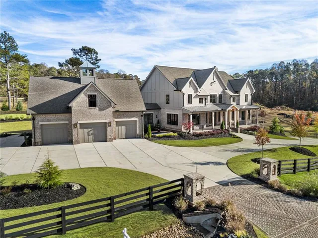 a front view of a house with a yard and porch