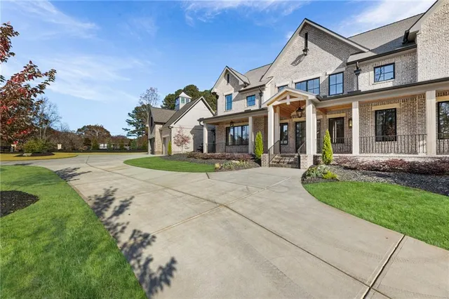 a view of a patio with a table and chairs