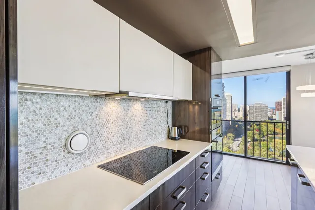 a kitchen with a sink and a stove