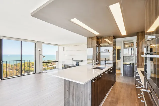 a kitchen with a sink stove and cabinets