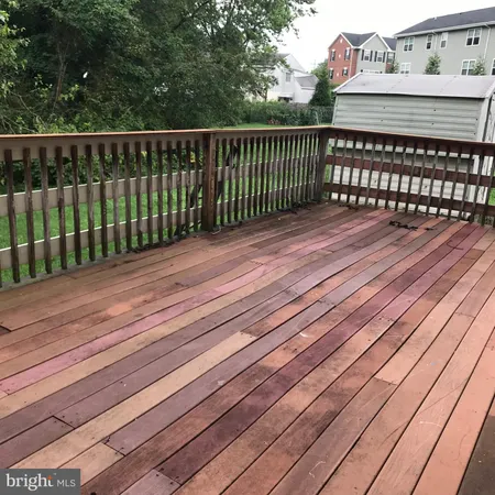a view of a balcony with wooden floor