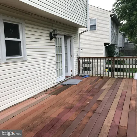 a view of backyard with a deck