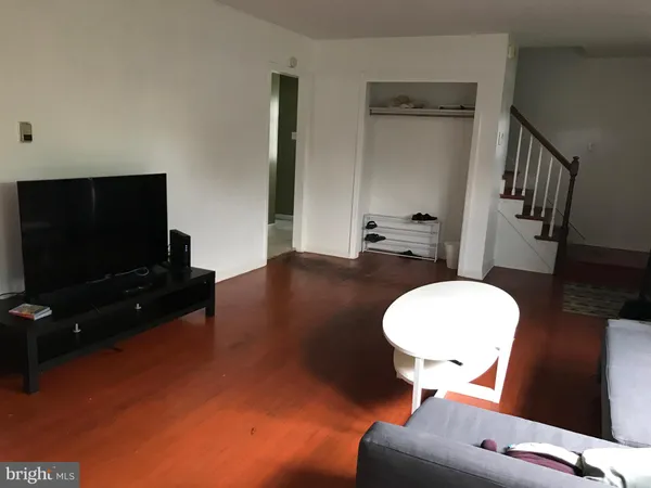 a room with furniture and a flat screen tv