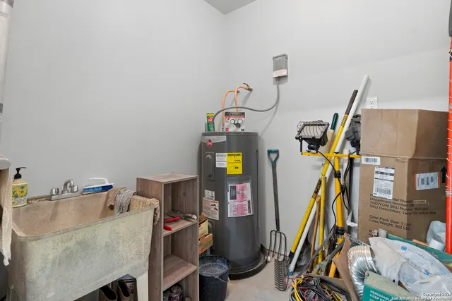 a view of a hallway with wooden floor and furniture