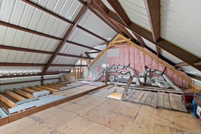 a bathroom with double vanity and a mirror