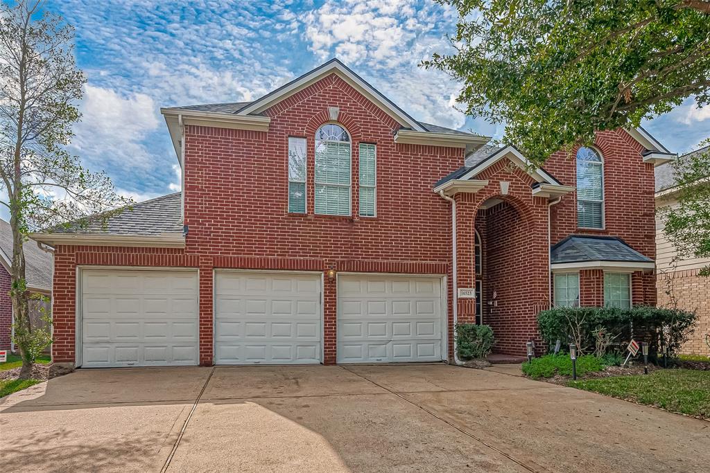 16523 Pinon Vista Drive Houston, TX 77095 - Photo 1 of 50 front view of a house with a garage