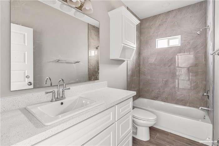 1614 Playa Drive, Unit 2 Weslaco, TX 78596 - Photo 7 of 8 a bathroom with a sink toilet and shower