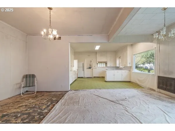 a view of a livingroom and a kitchen