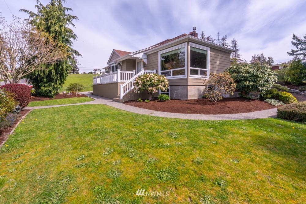 a front view of a house with a yard