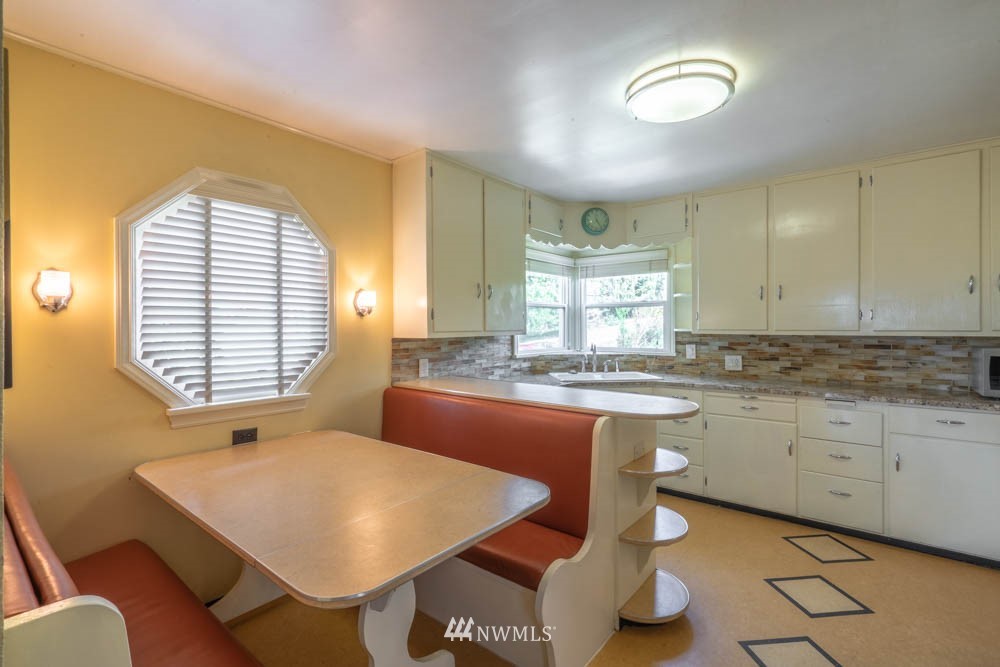 11481 Walker Road Mount Vernon, WA 98273 - Photo 14 of 38 a kitchen with a white cabinets and chairs