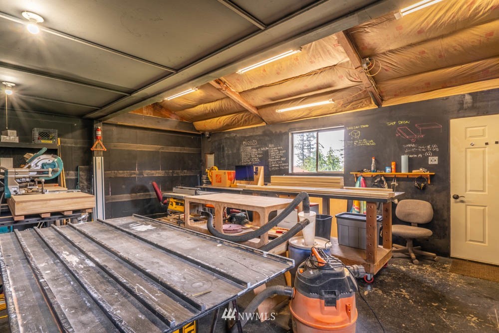 11481 Walker Road Mount Vernon, WA 98273 - Photo 35 of 38 a roof deck with table and chairs