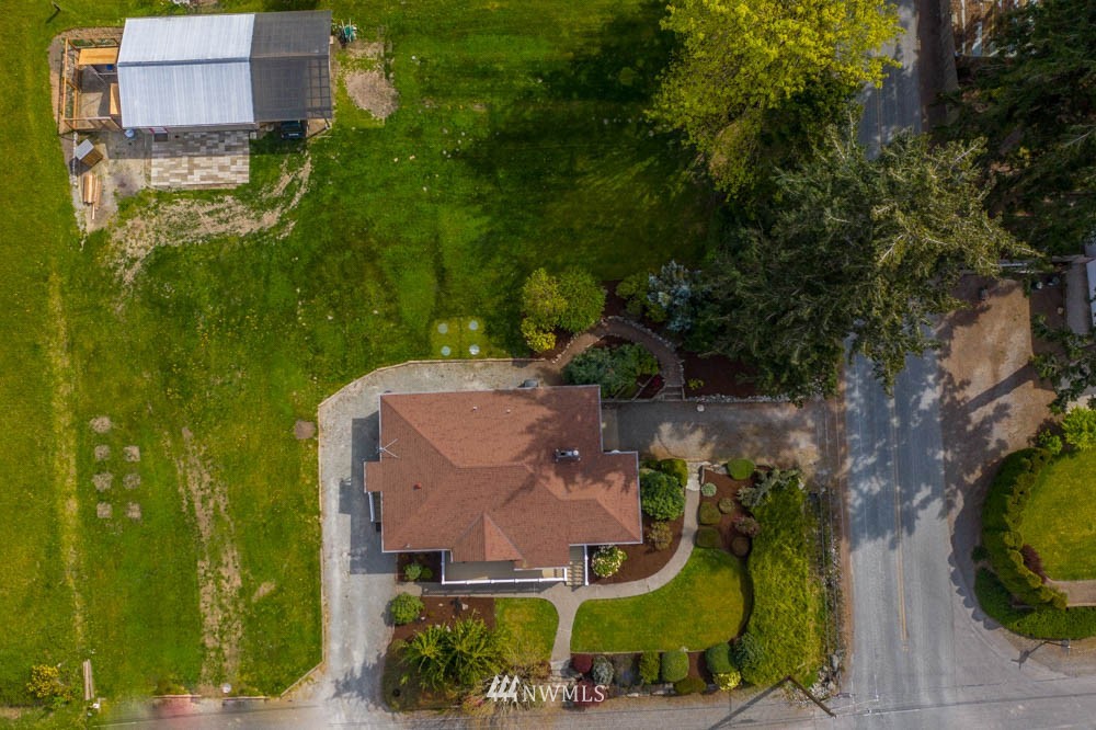 11481 Walker Road Mount Vernon, WA 98273 - Photo 5 of 38 an aerial view of a house with a garden and trees