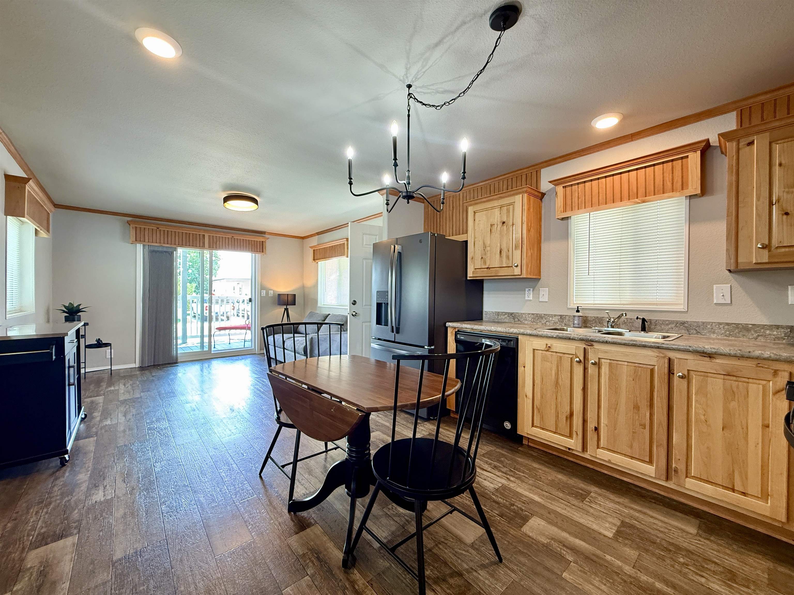 435 32 Road, Unit 830 Clifton, CO 81520 - Photo 11 of 28 a view of a dining room with furniture window and wooden floor