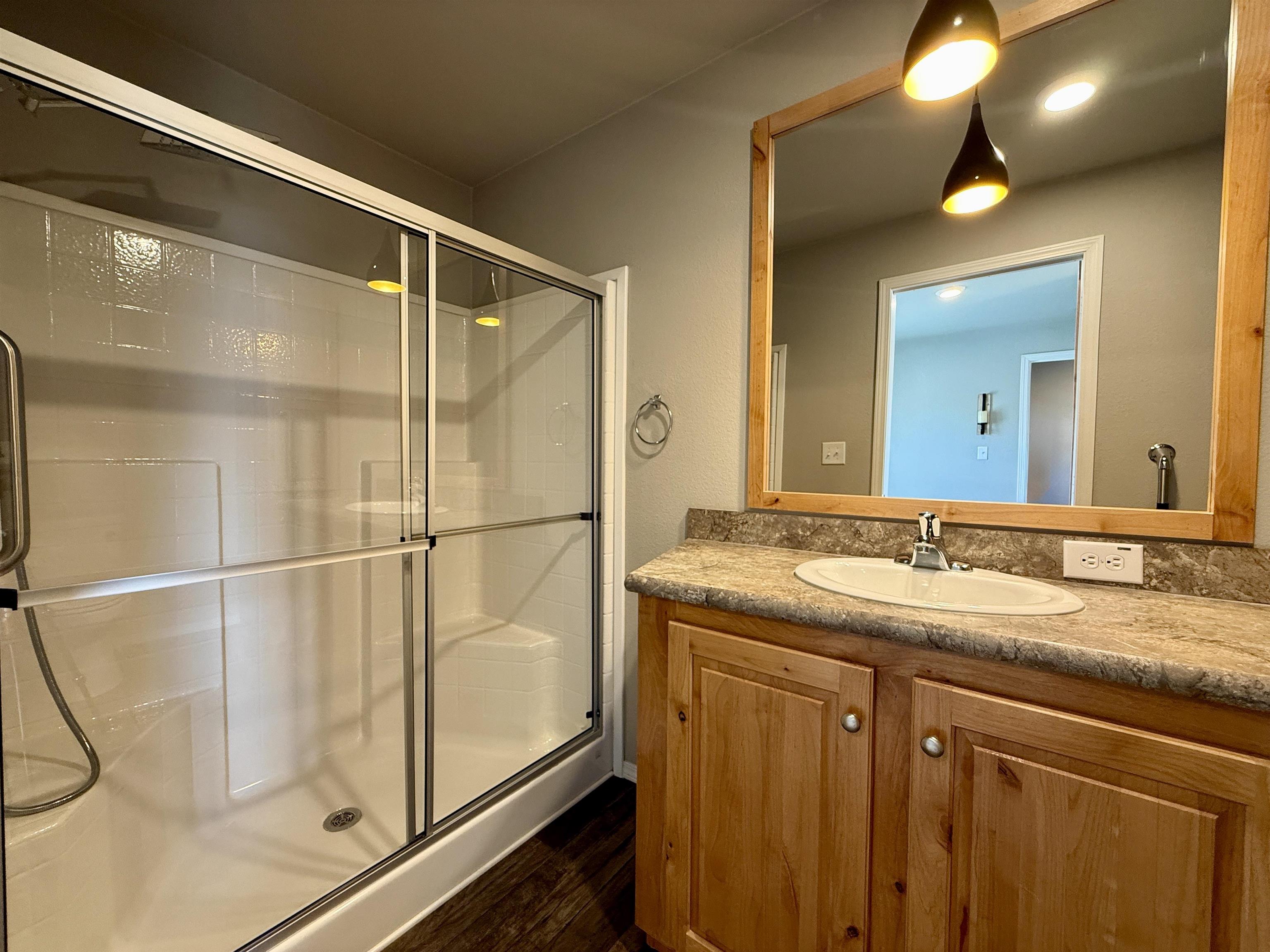 435 32 Road, Unit 830 Clifton, CO 81520 - Photo 14 of 28 a bathroom with a granite countertop sink and a mirror