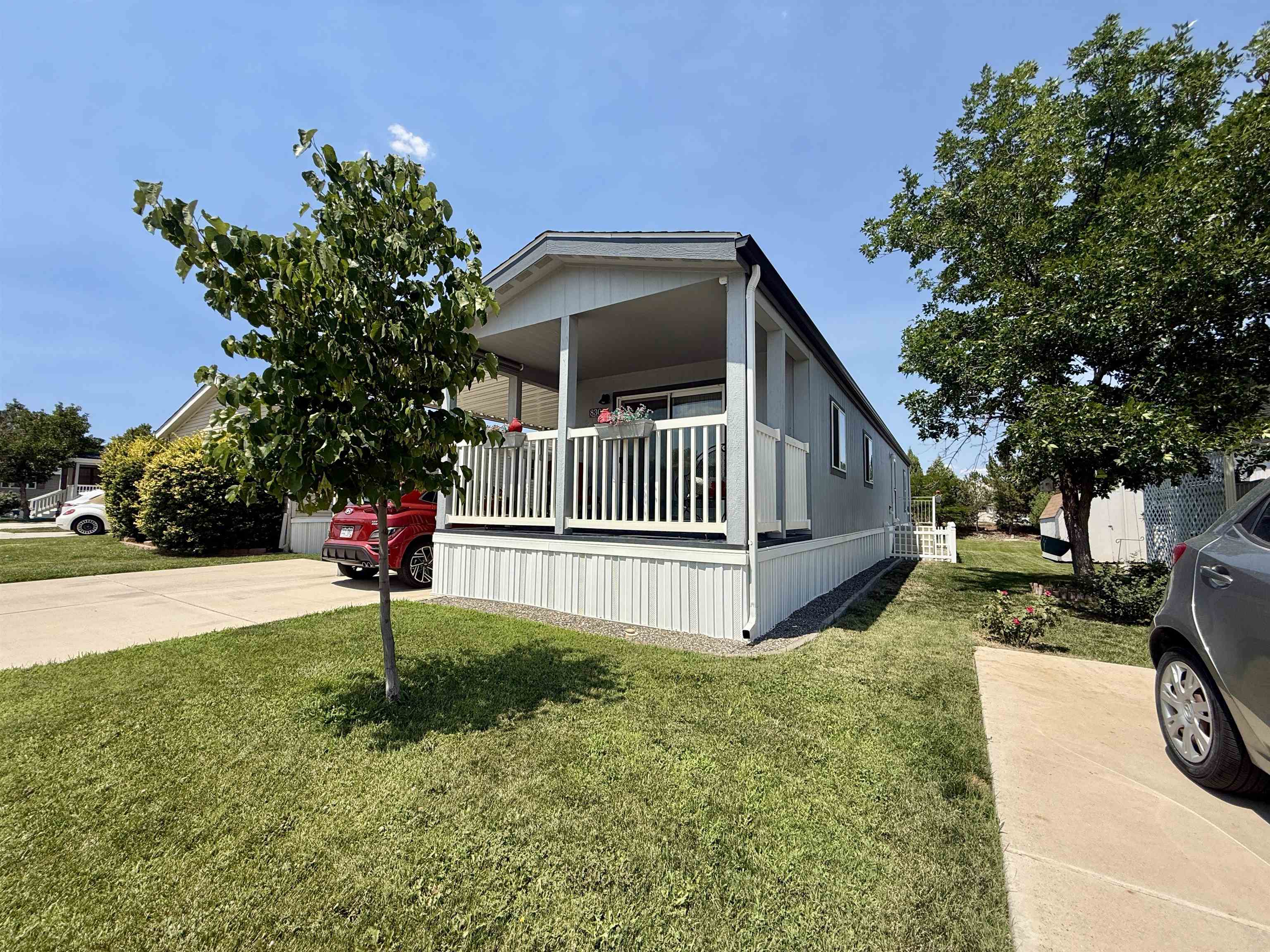 435 32 Road, Unit 830 Clifton, CO 81520 - Photo 2 of 28 a view of a house with a yard