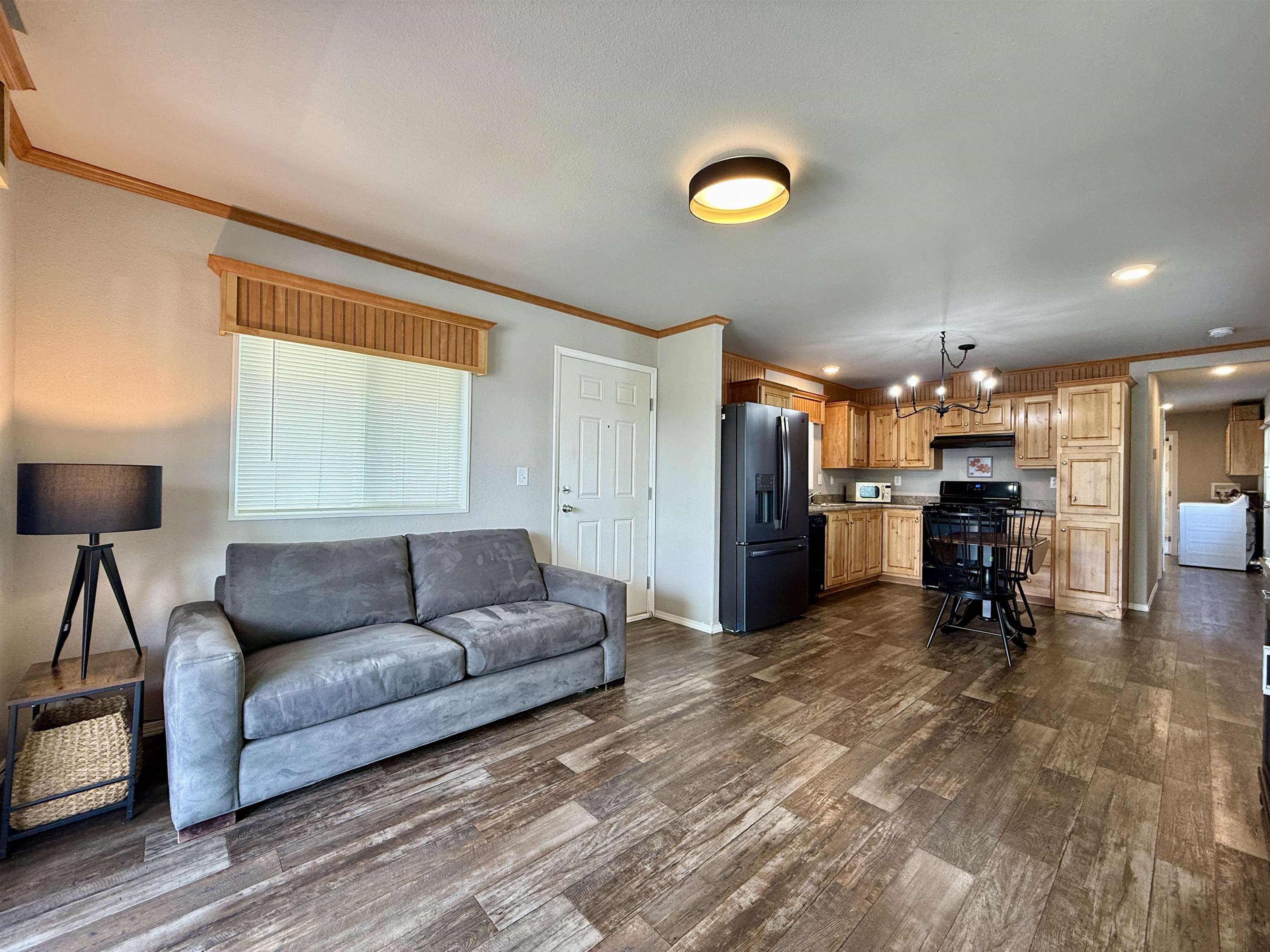 435 32 Road, Unit 830 Clifton, CO 81520 - Photo 7 of 28 a living room with furniture and a flat screen tv