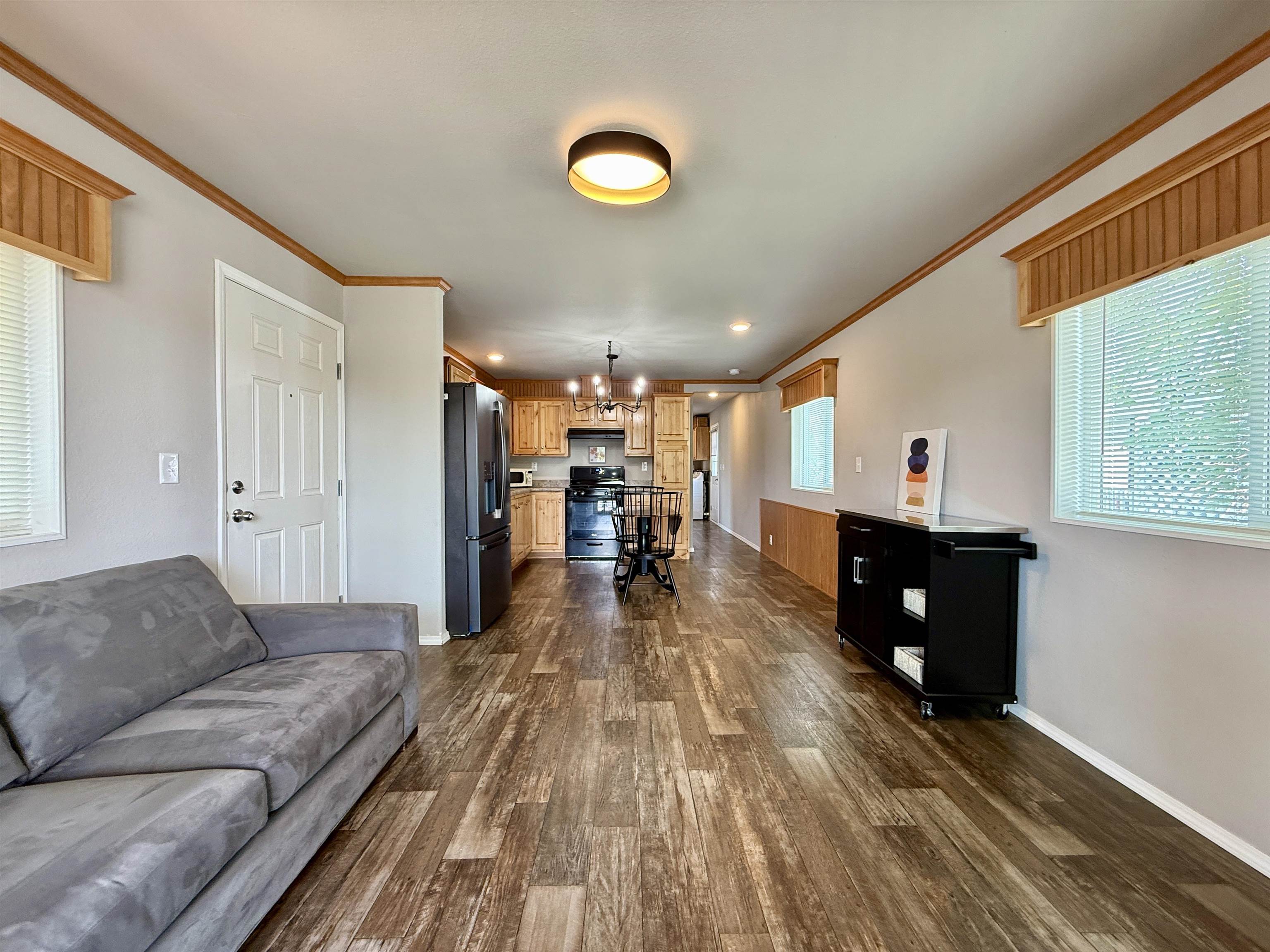435 32 Road, Unit 830 Clifton, CO 81520 - Photo 8 of 28 a living room with furniture and a wooden floor