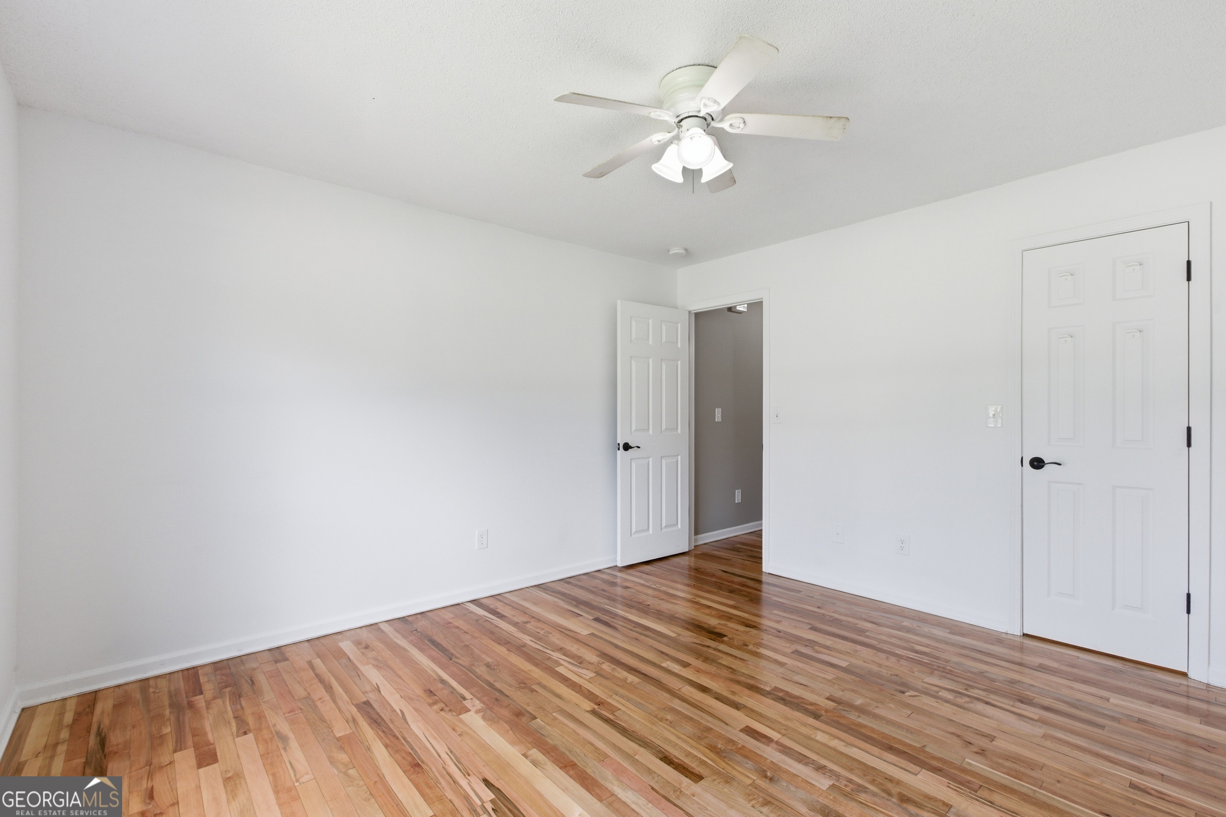 171 Winding Way Hartwell, GA 30643 - Photo 23 of 37 a view of an empty room with wooden floor