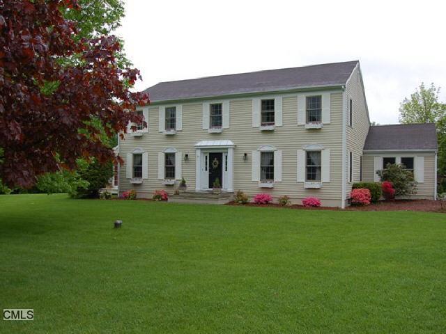 2 Tremont Road Brookfield, CT 06804 - Photo 1 of 1 a front view of the house with garden and trees