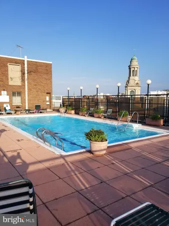 a view of a swimming pool with a lounge chairs