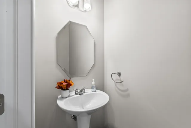 a bathroom with a sink and mirror