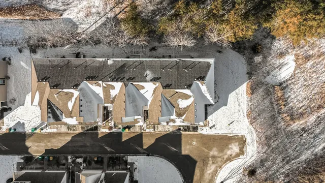 an outdoor sitting area with furniture