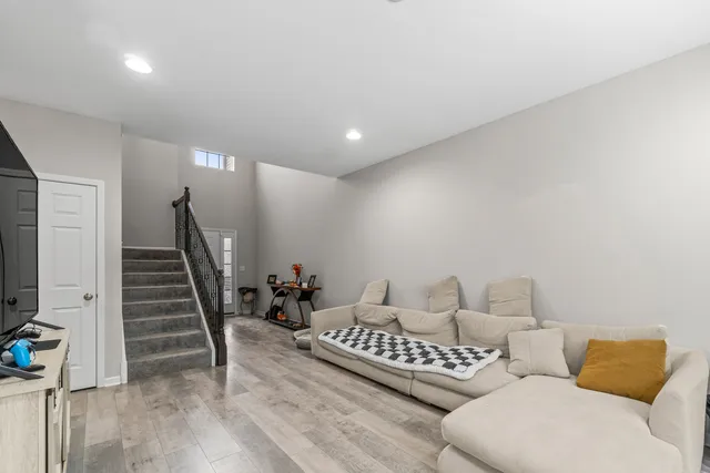 a bedroom with furniture and wooden floor