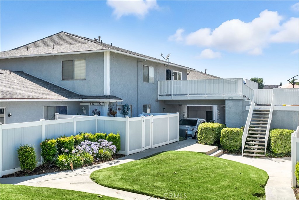 20788 Plum Canyon Road Saugus, CA 91350 - Photo 1 of 1 a front view of a house with a garden and plants