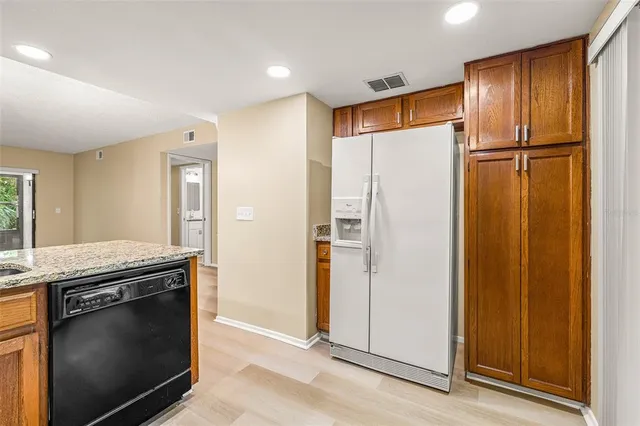 a kitchen with a stove and a refrigerator