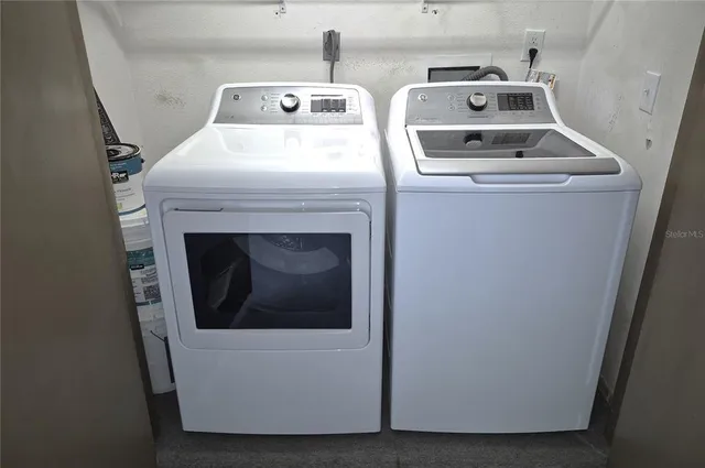 a utility room with dryer and washer