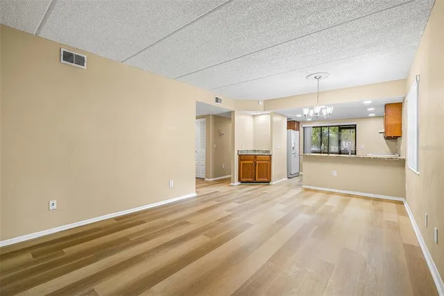 an empty room with a empty space and windows