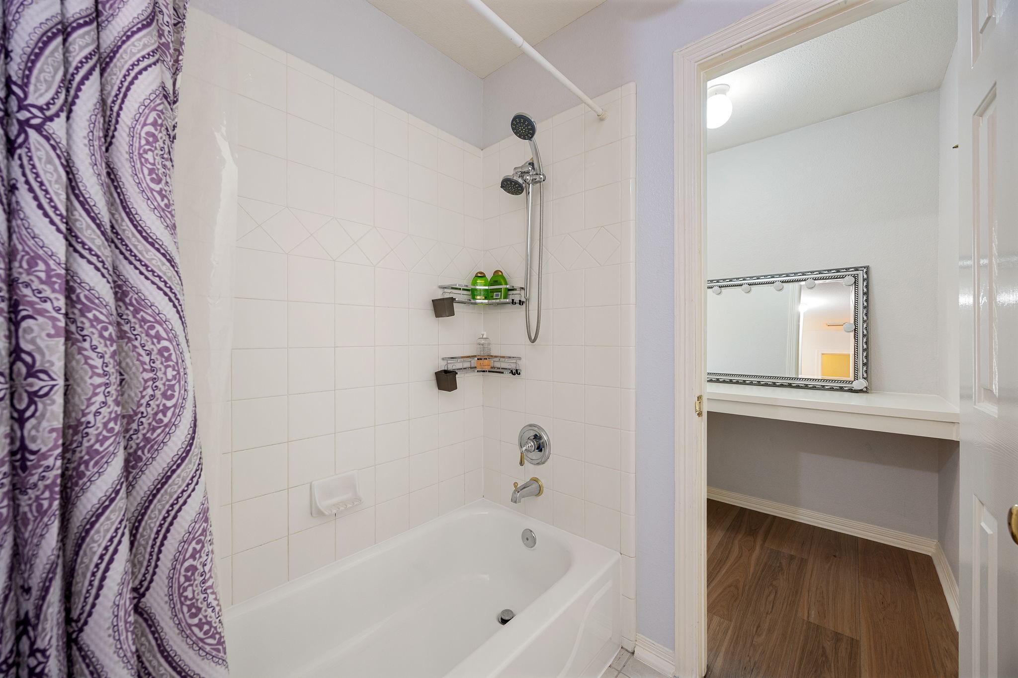 14419 Timbergreen Drive Magnolia, TX 77355 - Photo 22 of 43 Clean and functional tub/shower combo with tile surround, ideal for family or guests.