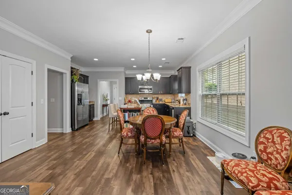 a view of backyard with seating and green space