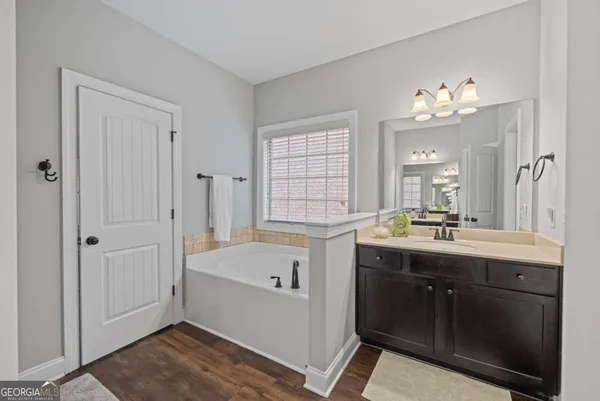 a bathroom with a sink a mirror and a toilet