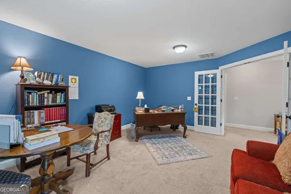 a bedroom with bed and a window