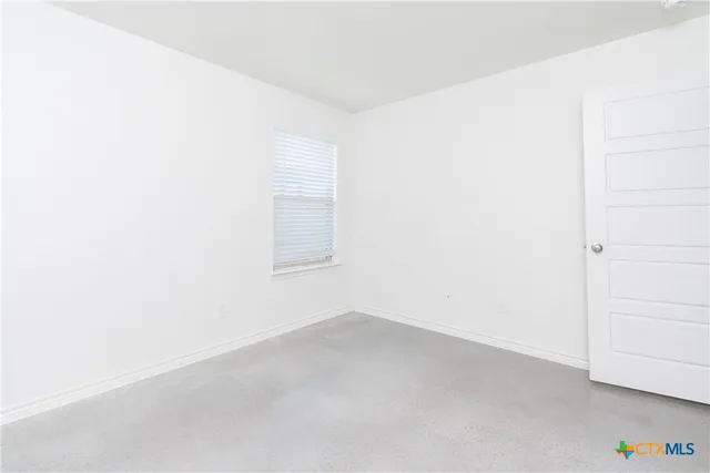 a bathroom with a granite countertop toilet a sink and bathtub
