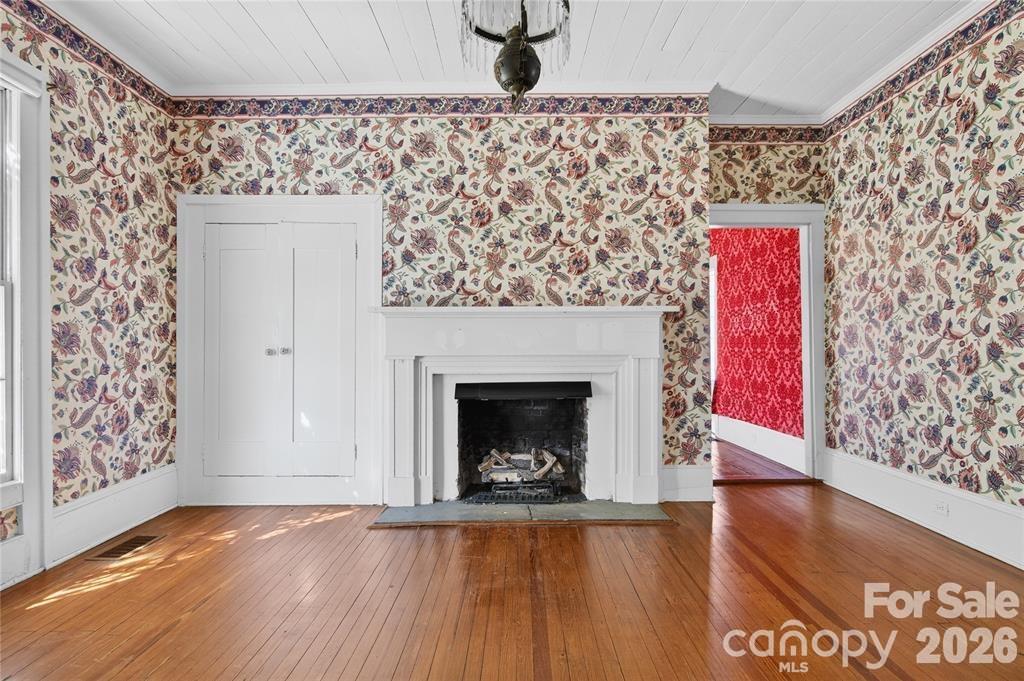 11124 Eastfield Road Huntersville, NC 28078 - Photo 15 of 41 a living room with a fireplace and wooden floor