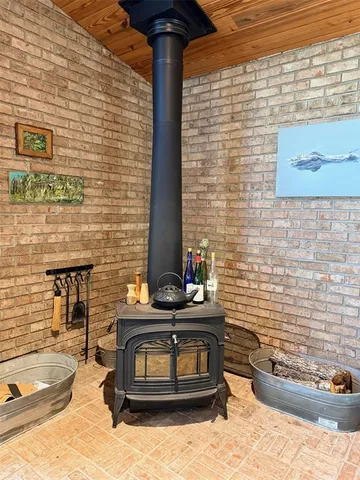 a bedroom with a bed a window and walk in closet