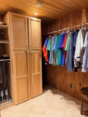a view of a backyard with table and chairs with a fire pit and a fire pit