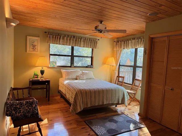 a view of balcony with wooden floor