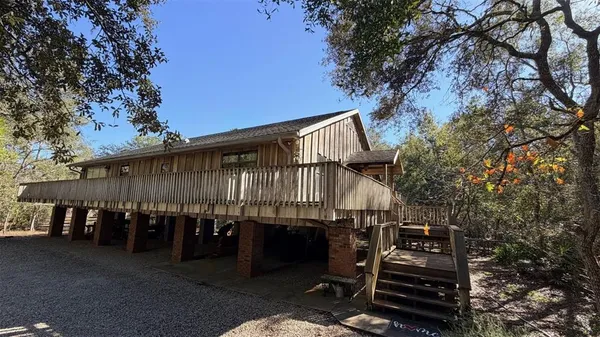 a view of a house with trees in the background