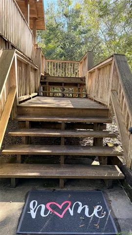 a backyard of a house with lots of green space and fountain