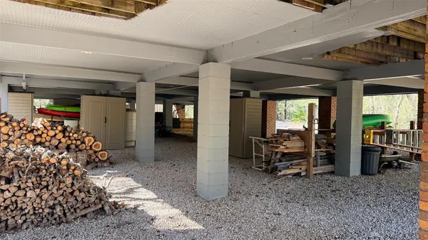 a view of a house with wooden fence