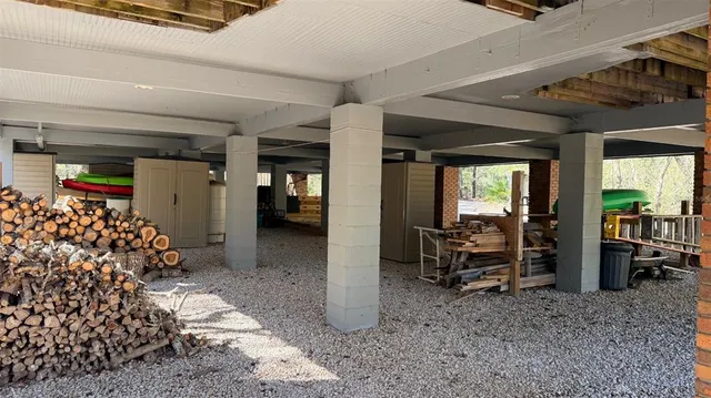 a view of a house with wooden fence